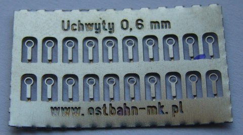 Uchwyty na poręcz, trąbkę 0,6 mm